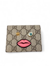 Gucci Supreme monogram face wallet.