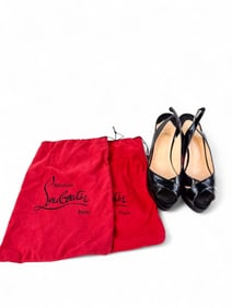 Christian Louboutin open toe patent leather heels.