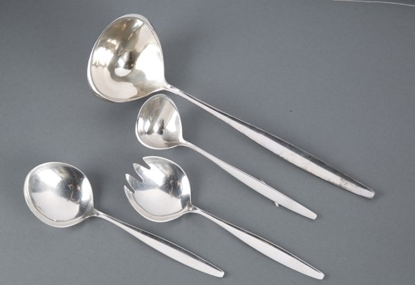 4 Georg Jensen serving pieves, Argo pattern: A group of four Georg Jensen Denmark sterling silver serving utensils in the Argo pattern. Marked on bottom of each. ++ Ladle. .18 t ozs. 12"l. ++ Serving spoon. 2.42 t ozs. 8"l. ++ Salad fork and spo