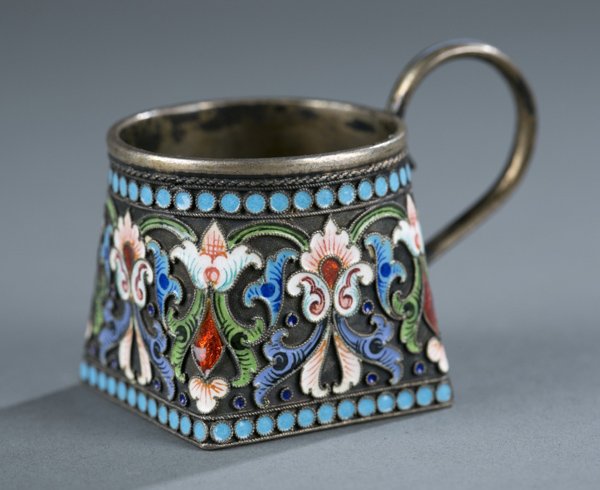 Russian cloisonne silver salt cellar: A Russian silver and cloisonne salt cellar with handle. Russian hallmark on bottom and numbered 84. 1 1/2"h x 2 1/4"w.