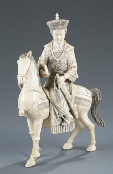 Chinese carved ivory courtesan riding horse, 19thc: A Chinese carved ivory courtesan holding a ruyi scepter and sword riding a horse. Late 19th/early 20th century. 6 3/4"h x 4 1/4"w.