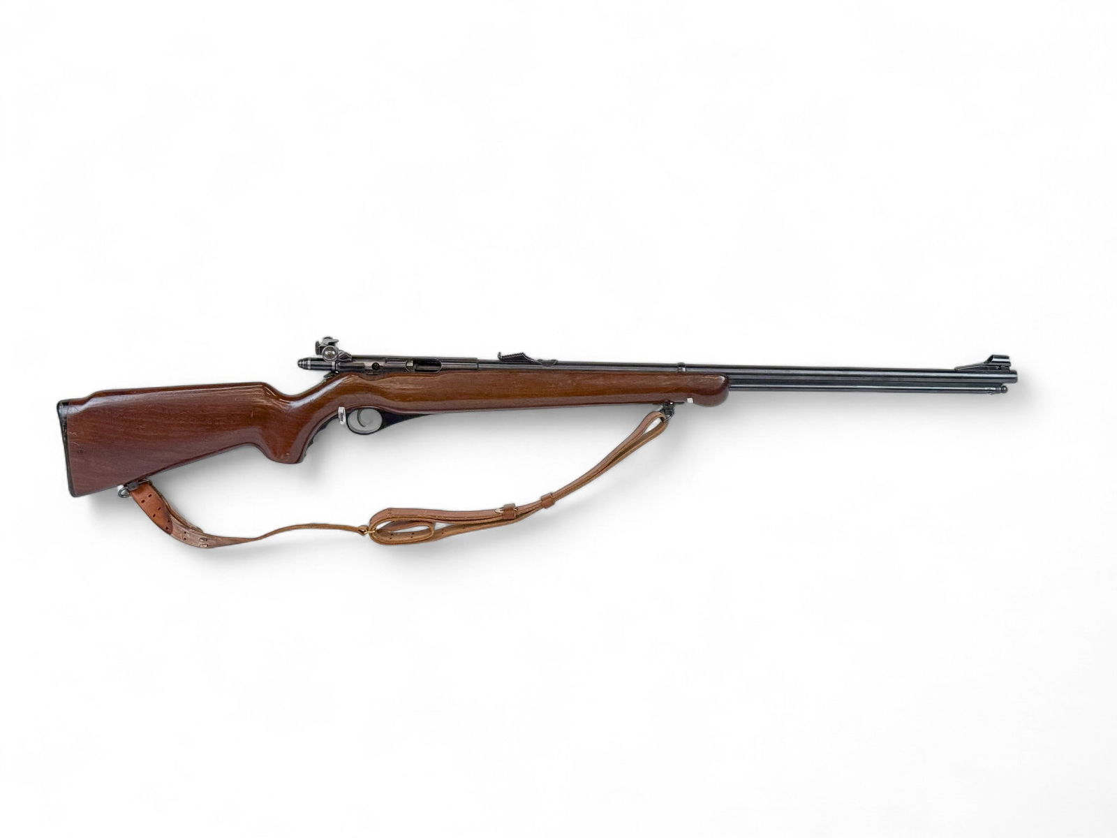 Mossberg M146B-Abolt action rifle, .22 Cal.: [Modern Firearm] An O.F. Mossberg Model 146B-A bolt action rifle, .22 S, L, & LR. Circa 1954-1958. Blued finish. 26" barrel with rear and ramped hooded front sight. Walnut semi pistol grip stock and l