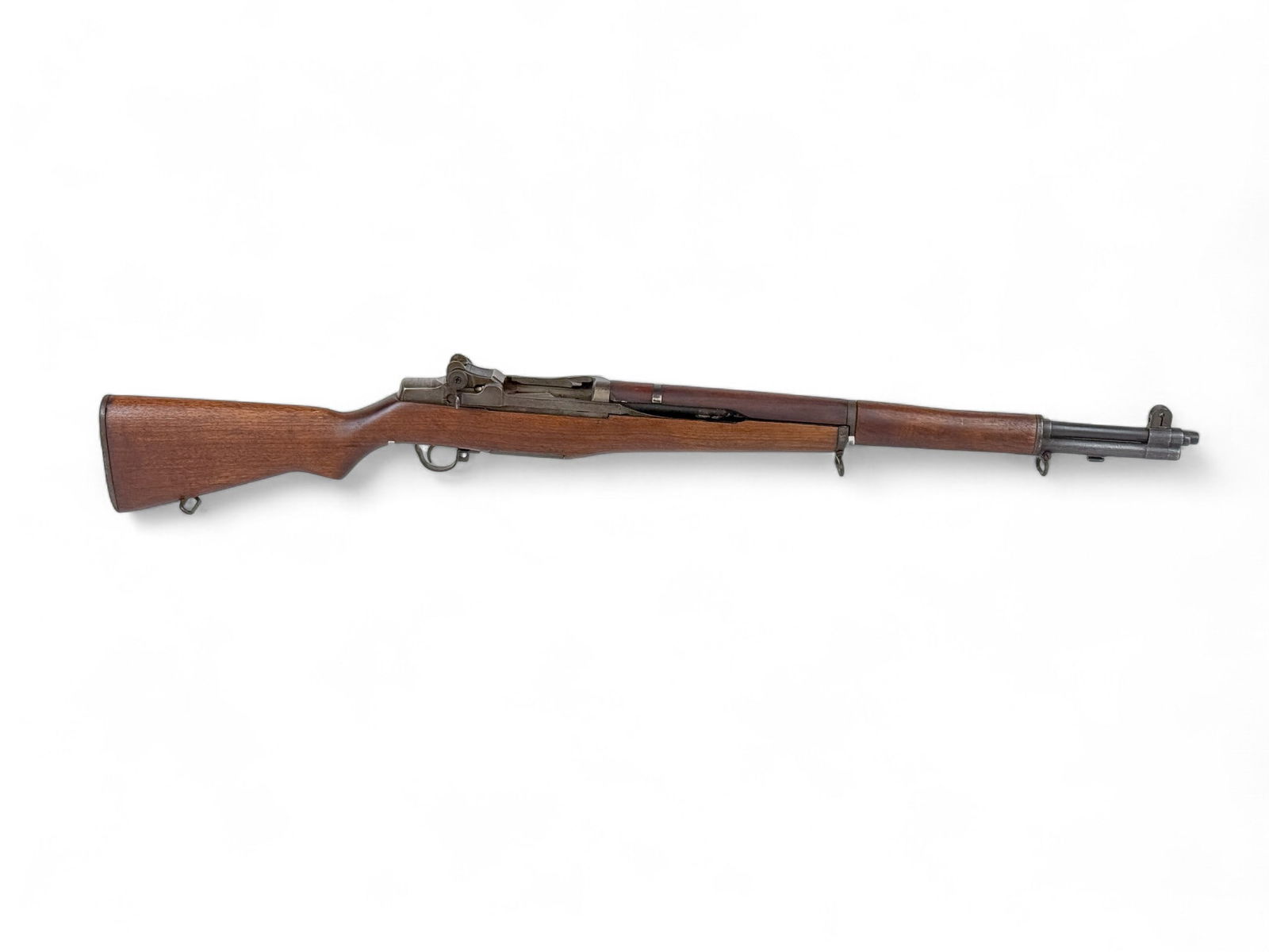 WWII Springfield M1 Garand semi-auto rifle,.30-06: [Modern Firearm] A 1944 WWII Springfield Armory M1 Garand semi-auto rifle, .30-06. Post War re arsenal. Parkerized finish. 24" Springfield Armory barrel. Walnut stock with Proof and re arsenal mark. 4