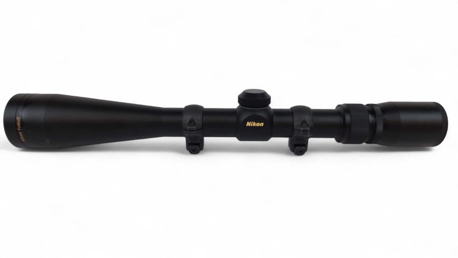 Nikon ProStaff 4-12x 40mm matte rifle scope: A Nikon ProStaff 4-12x 40mm matte rifle scope with scope rings with Weaver mounts. 14" overall.