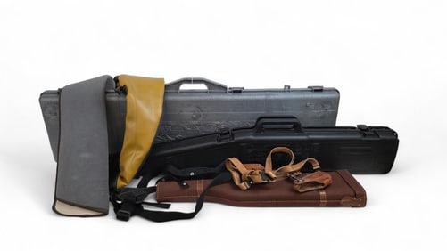 3 Rifle cases and 4 holsters