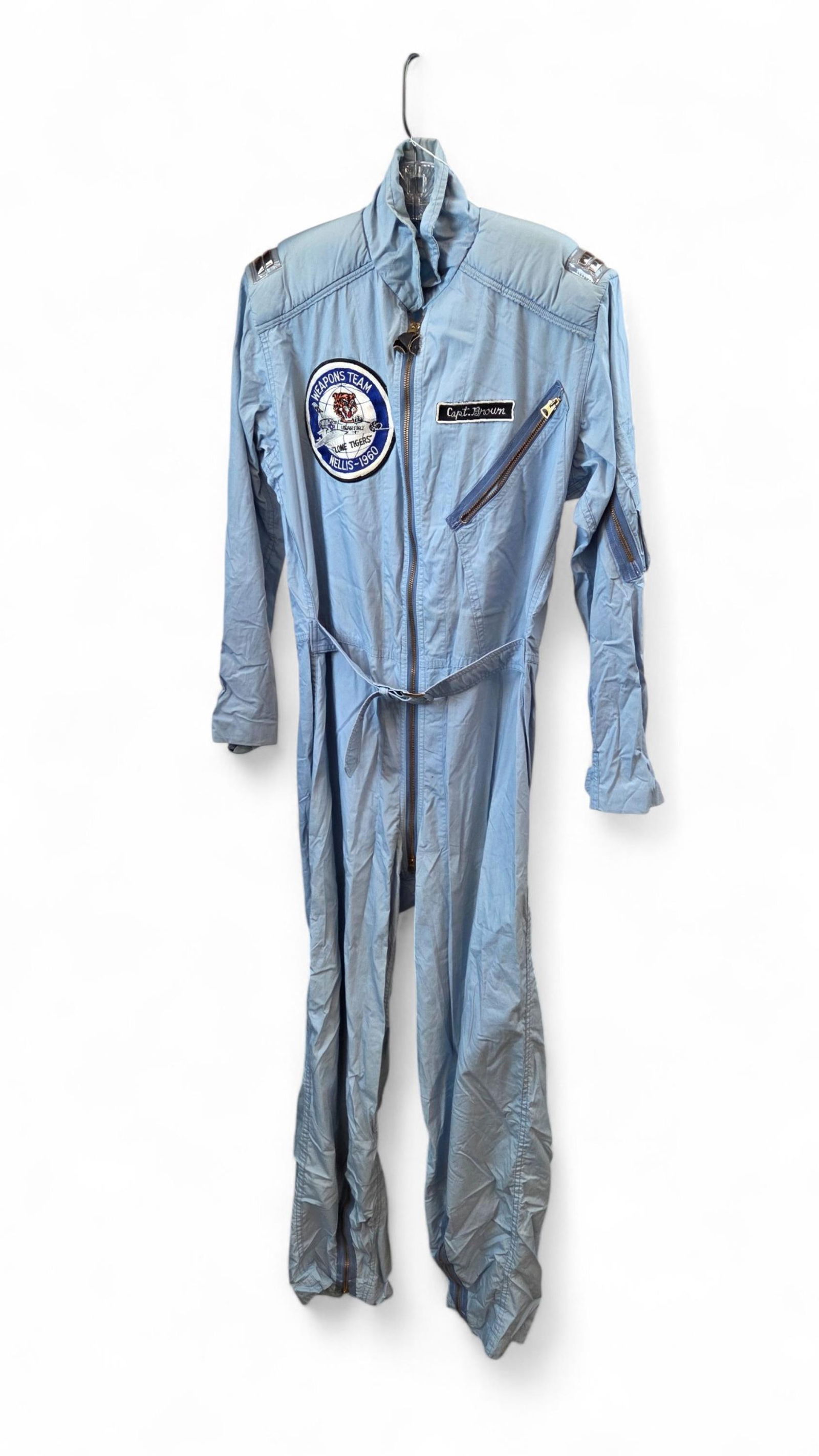 Gen. Brown 1960 William Tell flight suit: A USAF Lt. Gen. James R. Brown (1930-2015) Flite Wear 1960 William Tell Fighter Gunnery Meet flight suit. A 4520th Crew Training Wing "Lone Tigers" Weapons Team patch, Capt. Brown name tag, and captai