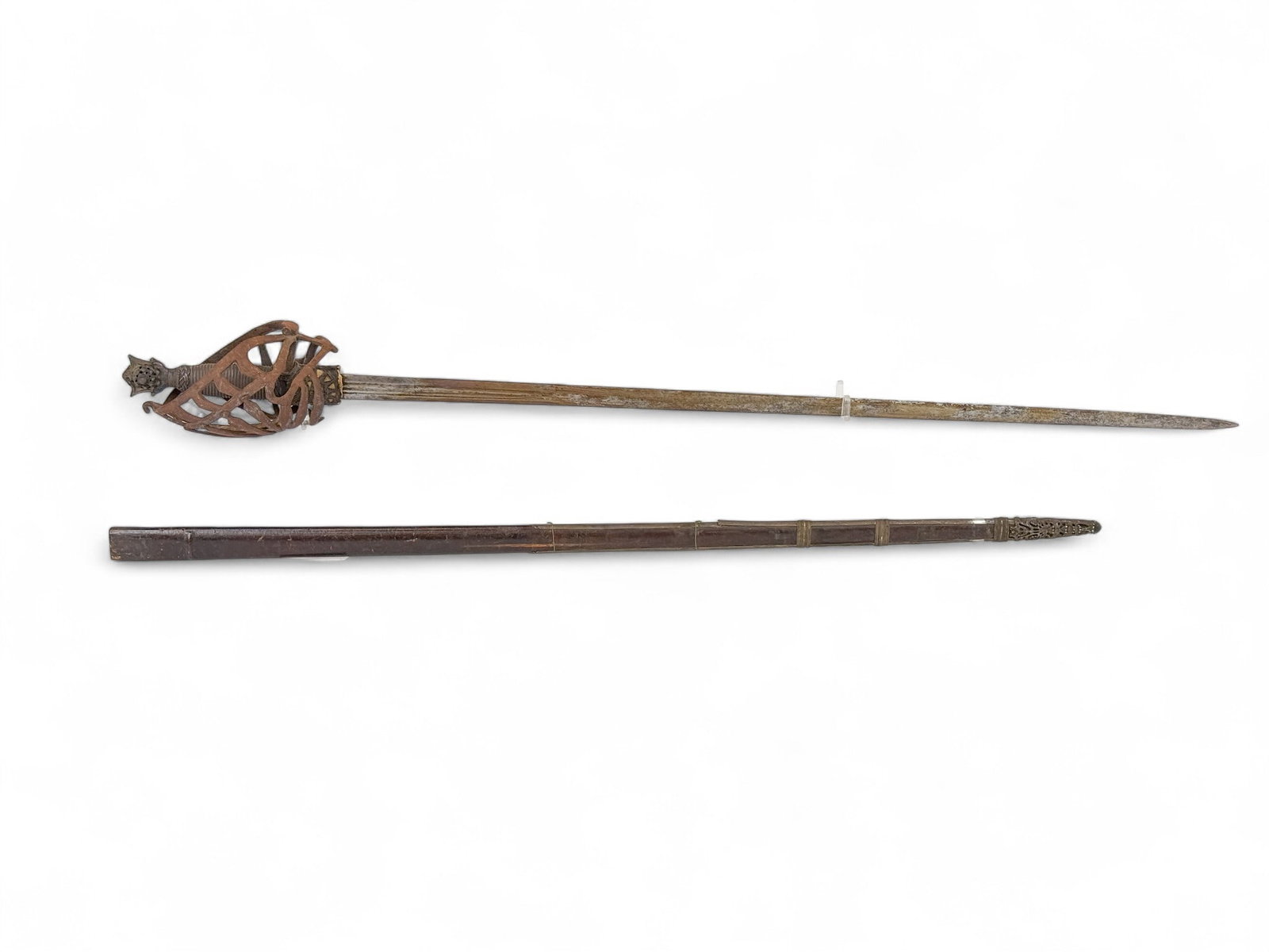 Italian Schiavona sword with scabbard: A Italian Schiavona basket hilted sword with scabbard, Circa 17th to18th Century. 36" broad three fuller blade with three identical touch marks. Metal grip with braid decoration. Wedge pommel. Iron mu