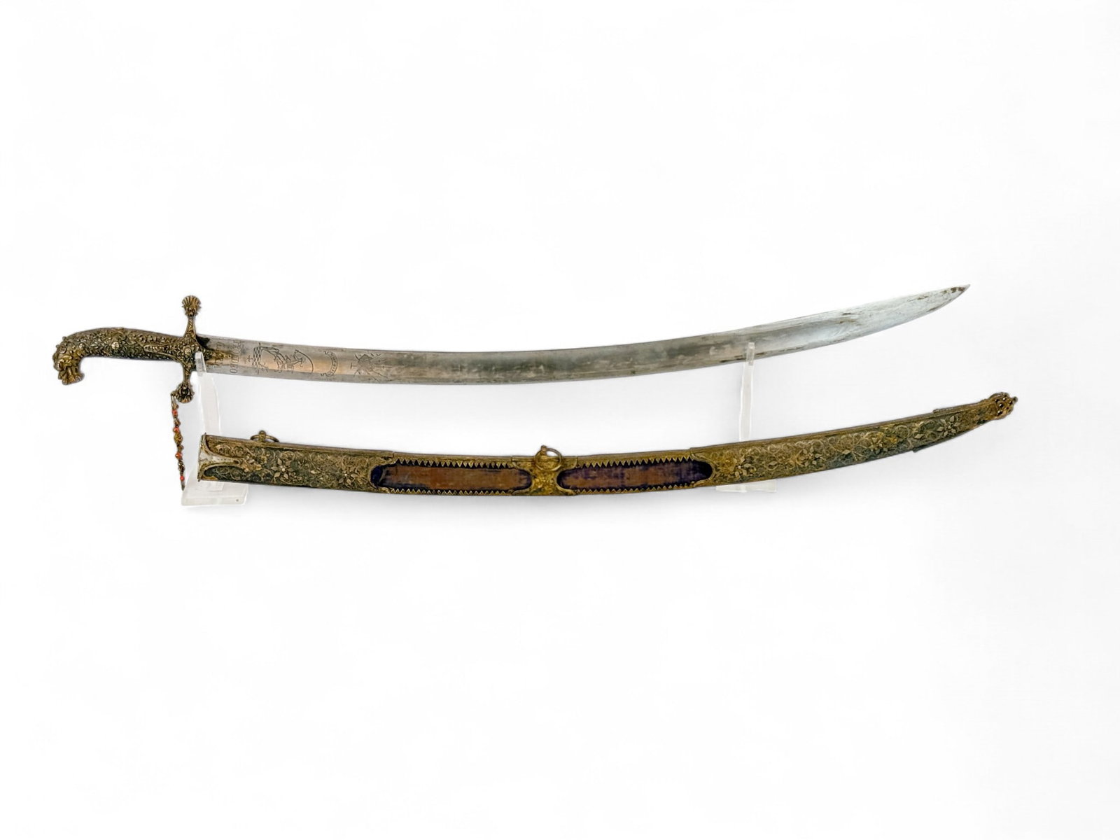 Hungarian-Polish szabla sword with scabbard: A Hungarian or Polish Hussar szabla sword with scabbard, 18th or 19th Century. Heavily decorated gilt silver crossguard and grip with dragon headed pommel and silver tassel with coral beads. 31 1/2" b
