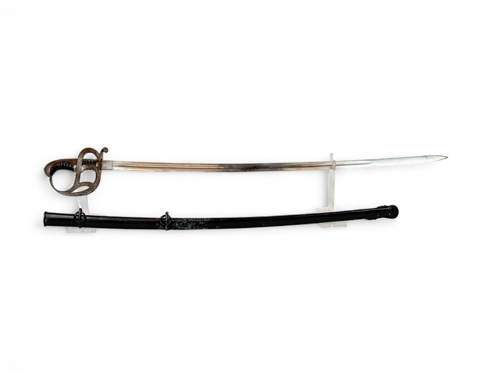 Prussian M1852 sword and scabbard: A Prussian Model 1852 sword and scabbard. 32" blade. Ricasso marked with shield maker mark. Steel crossguard and wood grip. 32 1/2" painted metal scabbard. 37" overall. Condition: Oxidation on guard a