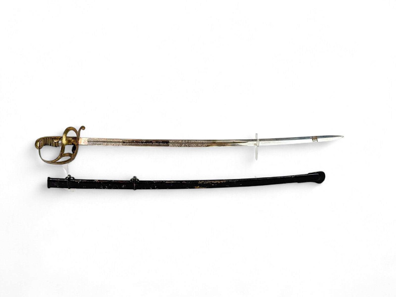 Prussian M1852 Train Battalion officer's sword: A Prussian Model 1852 type Brandenburgisches Train-Bataillon Nr. 3 ceremonial officer's sword. 31 1/2" blade. Ricasso marked "KN" and stamped with balance scales. Blade finely engraved Kaiser Wilhelm 