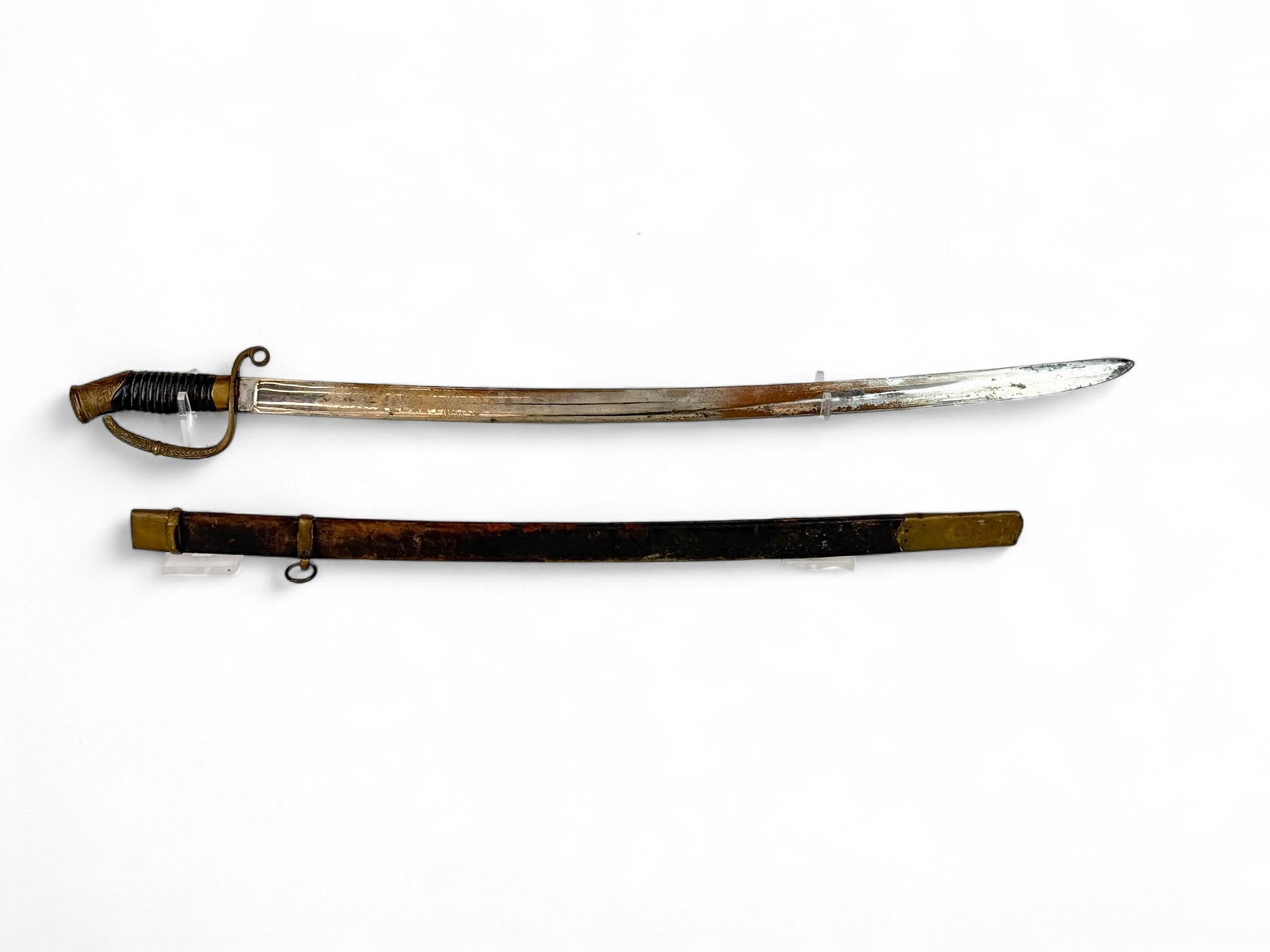 Russian M1881 Dragoon Officer's saber & scabbard: A Imperial Russian Model 1881/1909 Dragoon Officer's Shashka saber and scabbard. 30" single edged blade. Ricasso marked "II" and "III" and blade etched with Cyrillic and double headed eagle. Brass gua