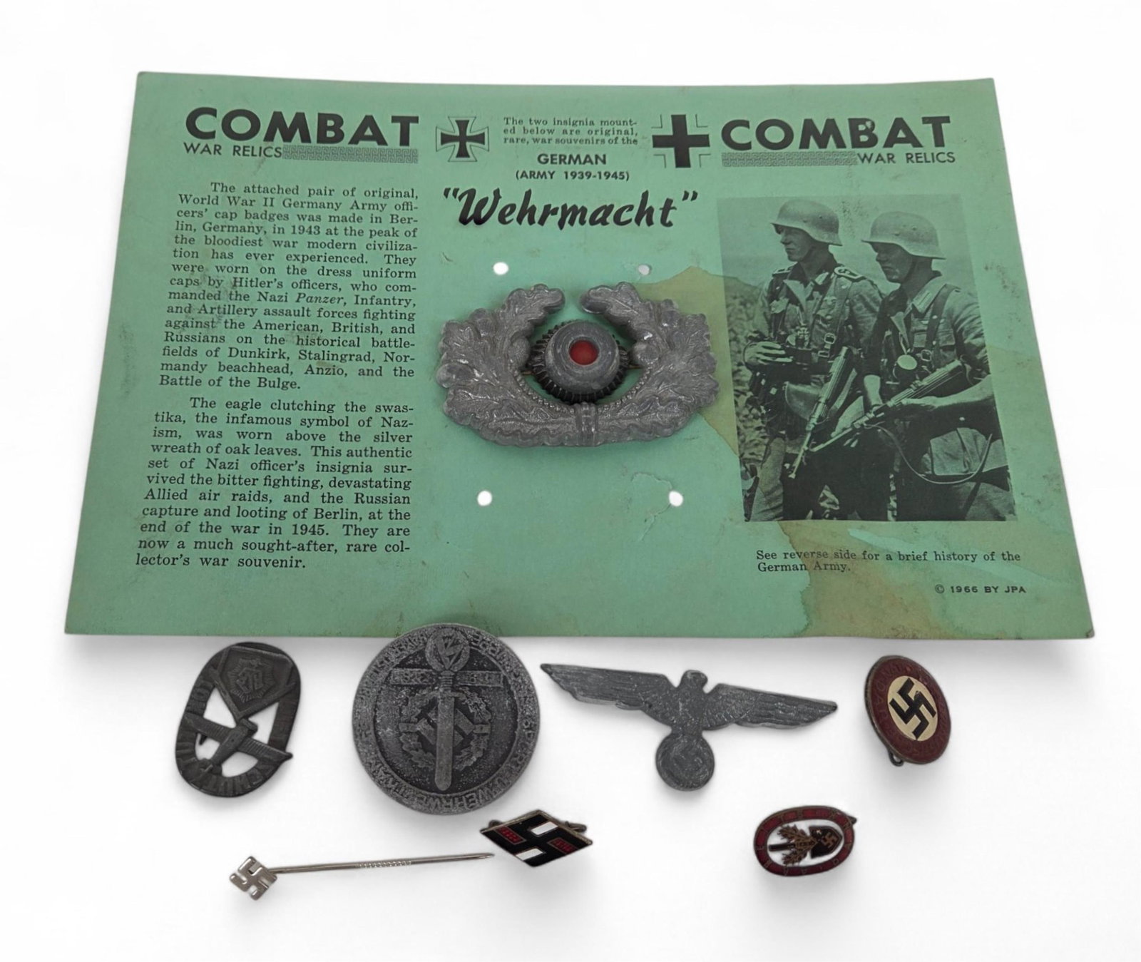 8 WWII German hat badges, badges, and pins: A group of eight WWII German hat badges, badges, and pins Army Officer's visor cap badge, 1939 SA Gruppe Westfalen Tinnie, NSDAP visor cap badge, Air Defense Emergency Badge, NSDAP badge RZM M1/25, RA