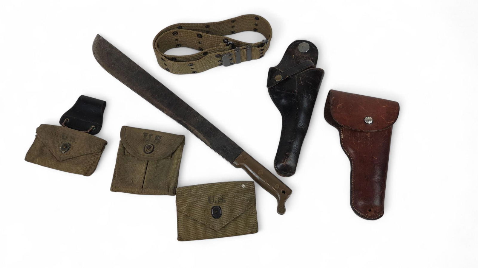 WW2 U.S. True Temper machete and webbing gear.: A WW2 U.S. True Temper machete, two M1924 First Aid Pouches, M1 Carbine magazine pouch, M36 webbing belt. and two commercial revolver holsters.
