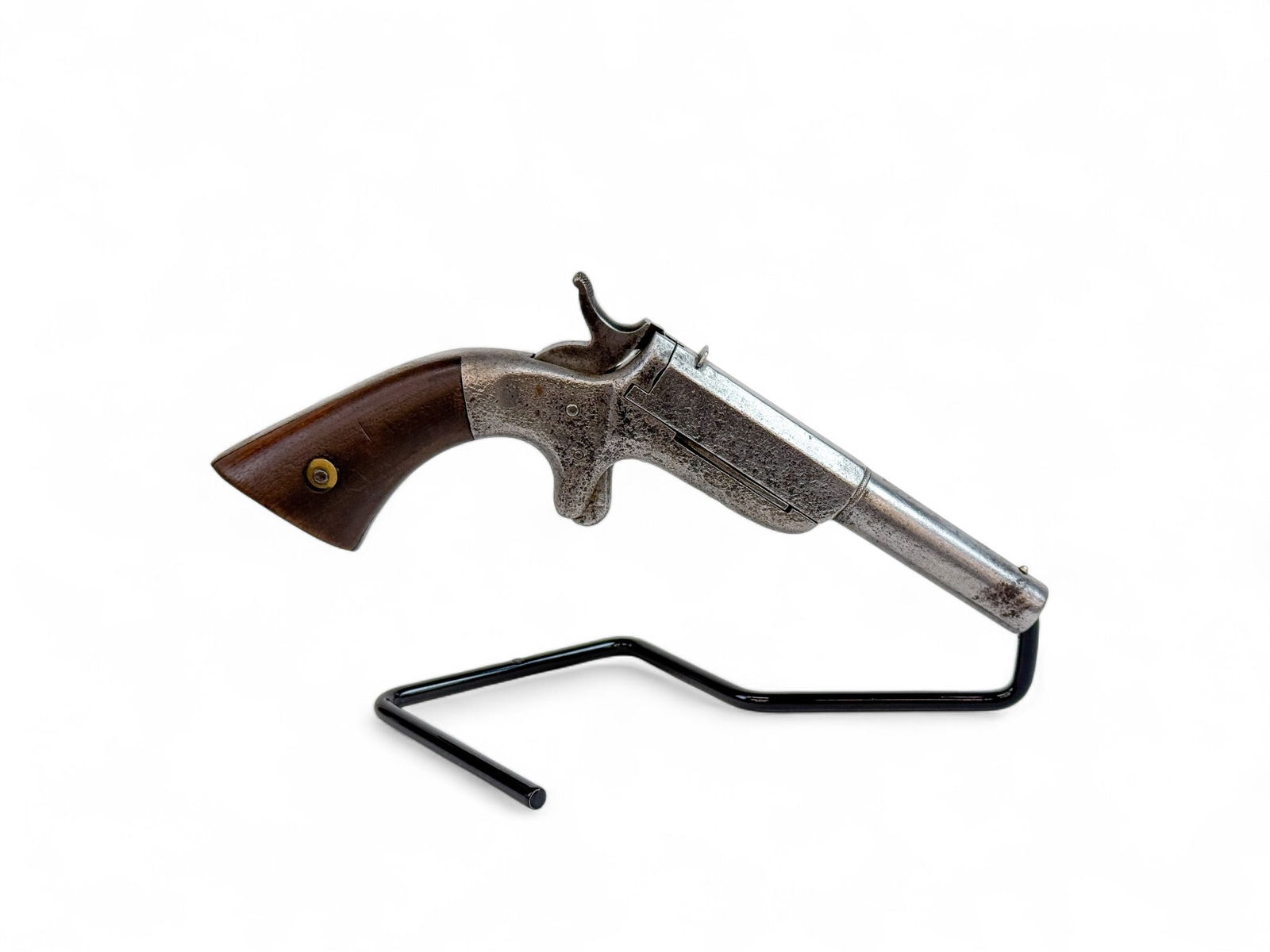 Ethan Allen single shot pistol, .32 RF: [Antique Firearm] An Ethan Allen 32 Center Hammer single shot pistol, .32 RF. Circa 1860s. 4" partly octagonal tiling barrel with extractor with fixed sights. Walnut square butt. Marked on side "E. AL