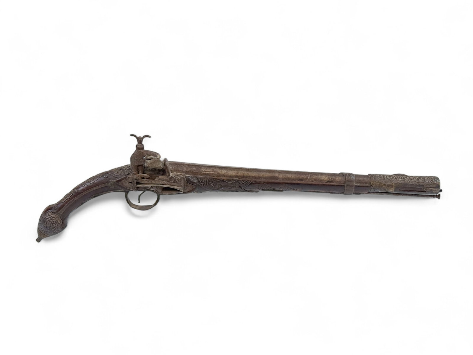 Ottoman Balkan rat tail miquelet pistol: [Antique Firearm] A Ottoman Balkan rat tail miquelet pistol, 19th Century. Wood stock with silvered mounts. Miquelet lock with stamped Arabic characters. 13 1/2" barrel signed. Includes ramrod. 20" ov
