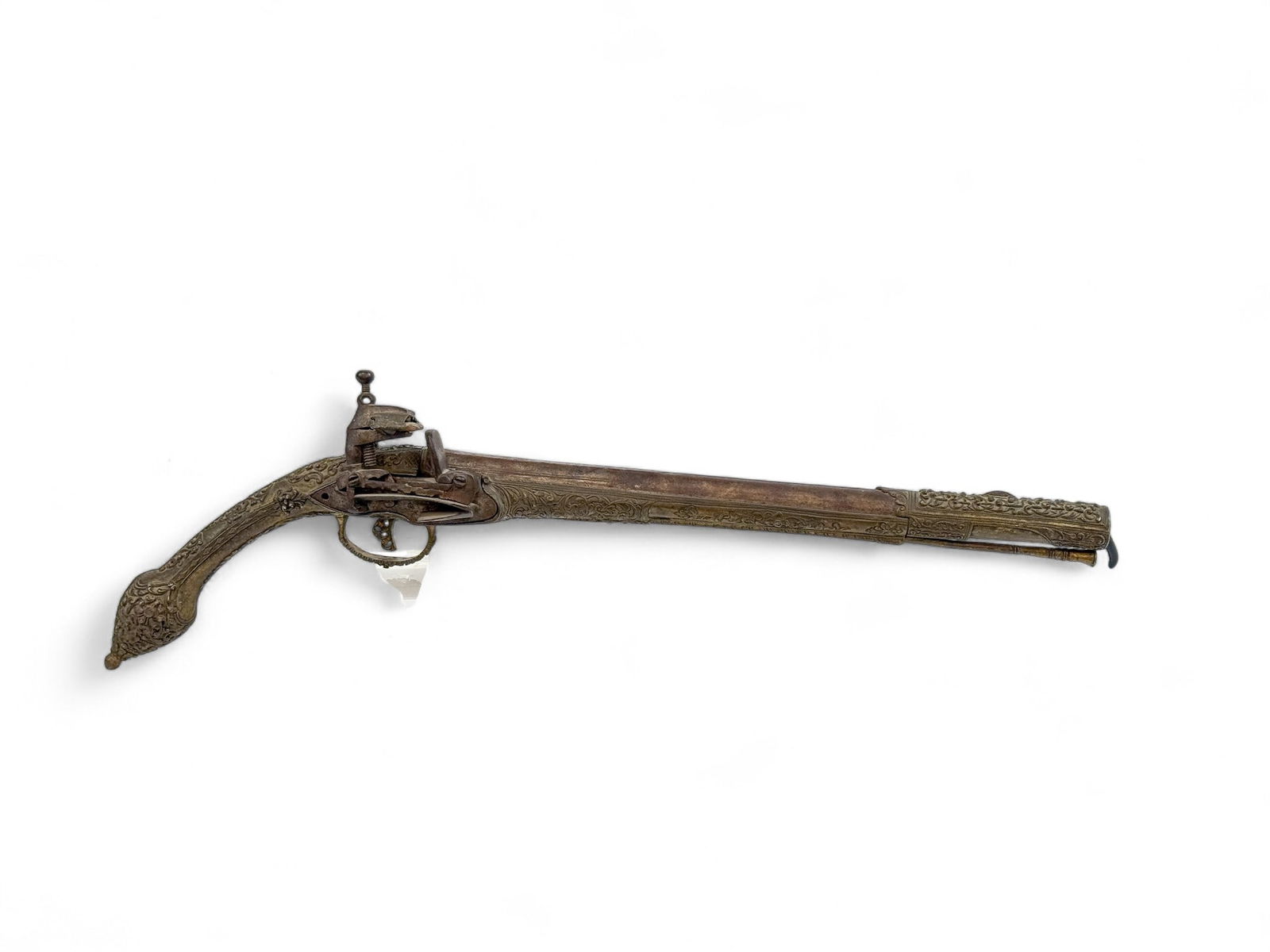 Ottoman Balkan rat tail miquelet pistol: [Antique Firearm] A Ottoman Balkan rat tail miquelet pistol, 19th Century. Ornate foliate and floral repousse and applied decoration on mounts. Miquelet lock with stamped Arabic characters. 12 1/2" ba