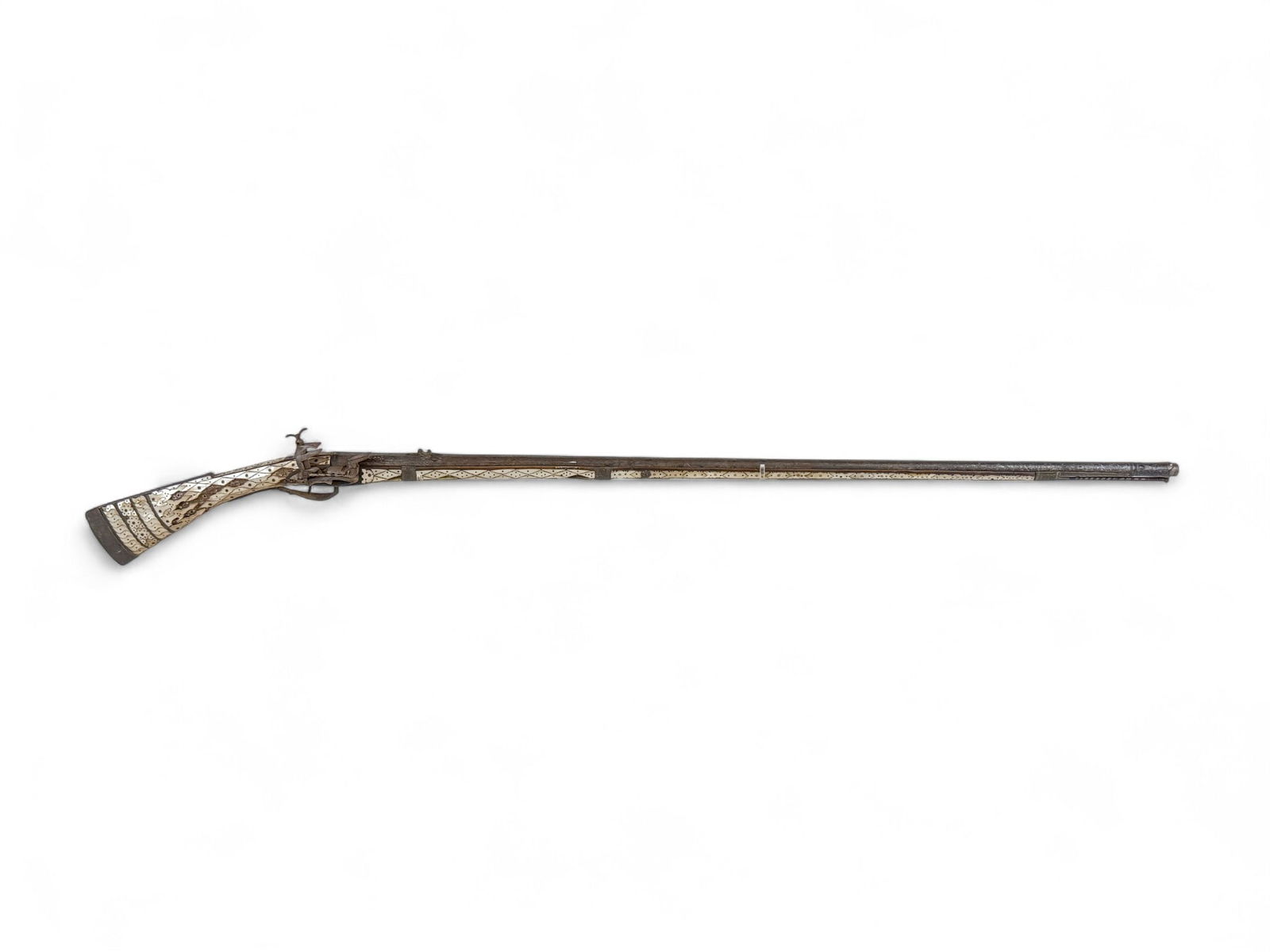 Balkan Dzeferdar Miquelet musket.: [Antique Firearm] An Ottoman Balkan Dzeferdar Miquelet lock musket, 19th Century. 45" barrel with Niello silver inlay with rear V sight. Full length stock with inlaid Mother of Pearl with silver mount