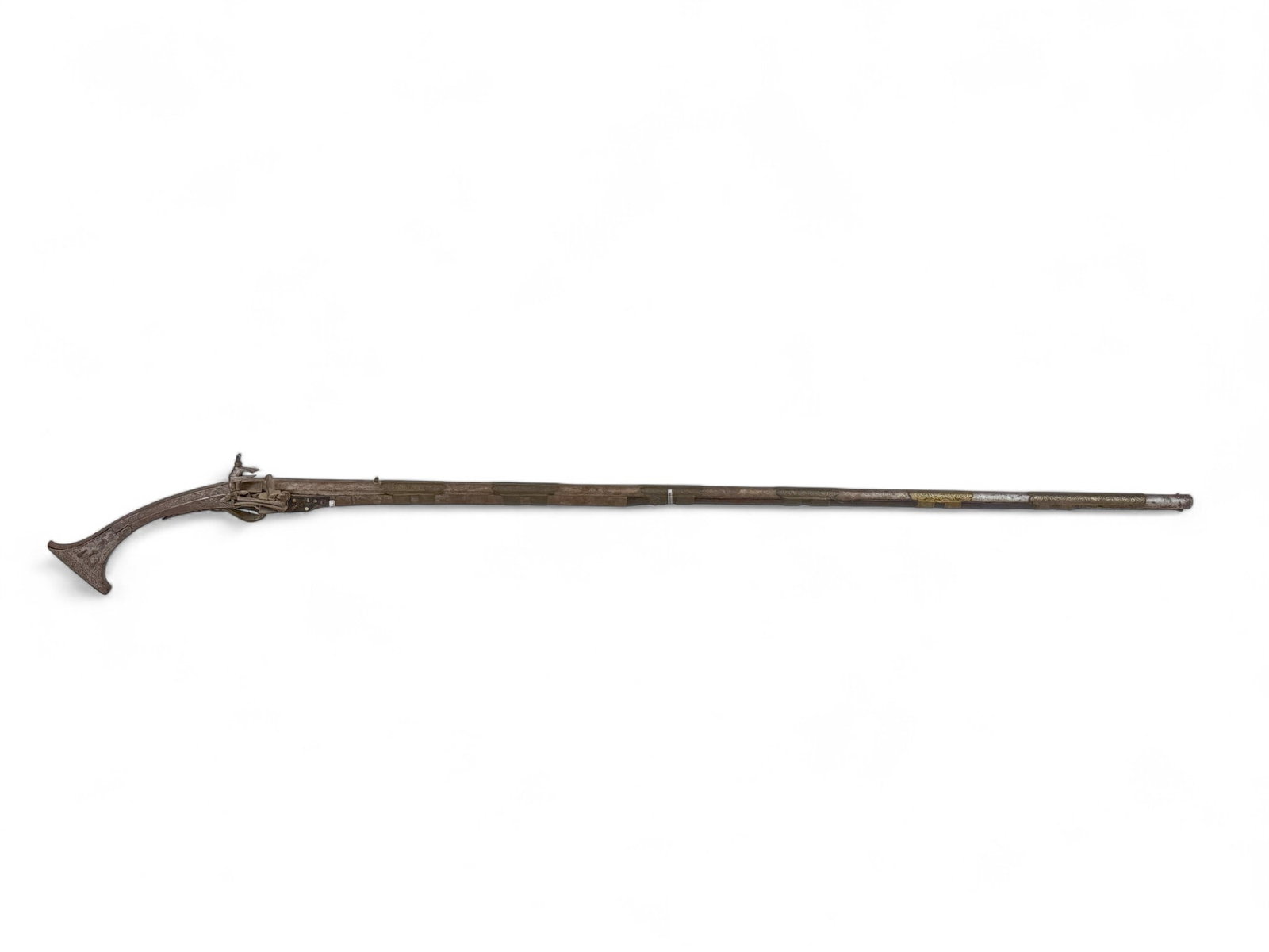 Balkan Tancica Miquelet musket.: [Antique Firearm] An Ottoman Balkan Tancica Miquelet lock musket. 19th Century. 52" barrel with front bead sight and rear V sight. Stock with etched silver on butt stock and brass barrel bands. Includ