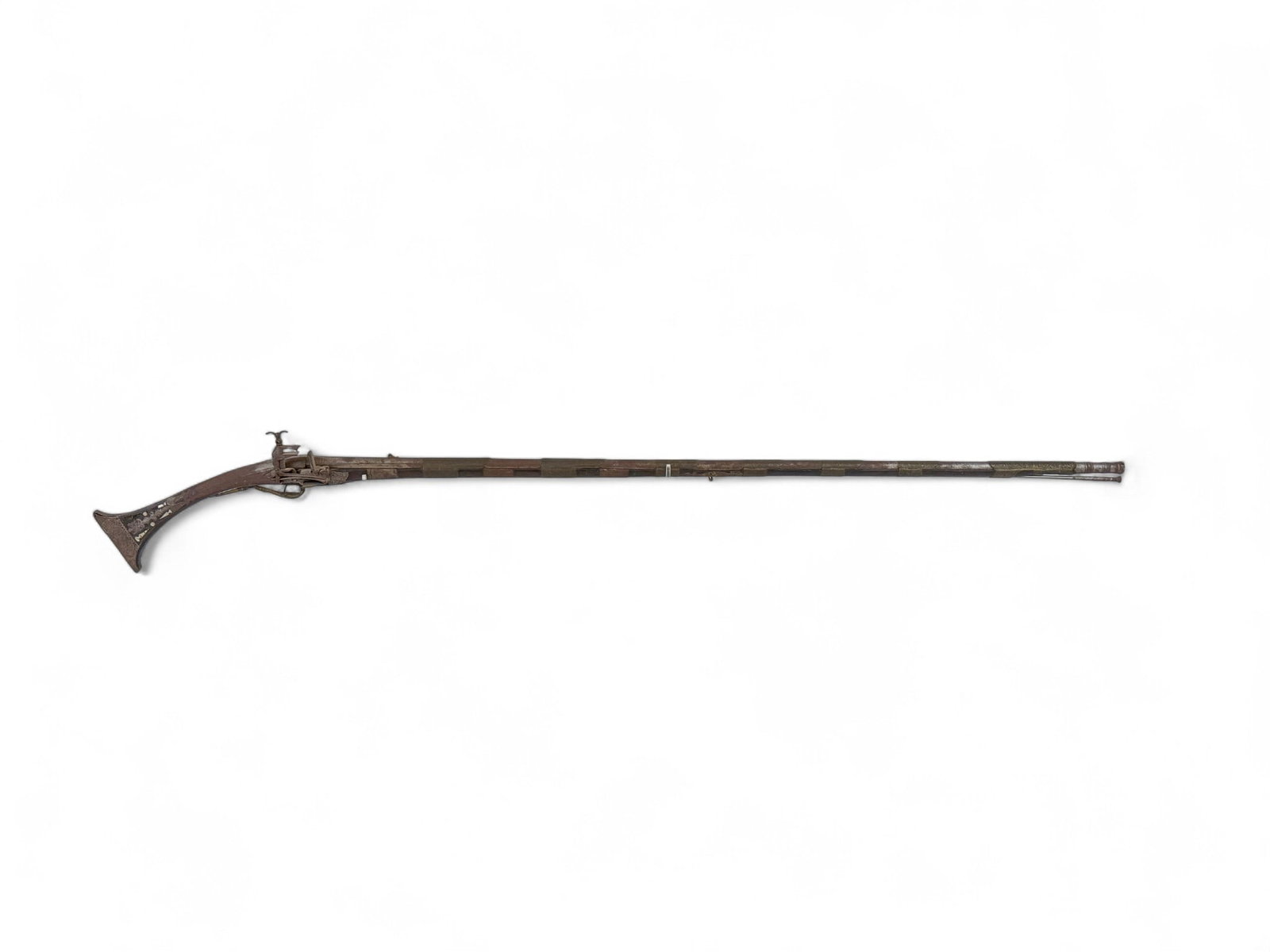 Balkan Tancica Miquelet musket.: [Antique Firearm] An Ottoman Balkan Tancica Miquelet lock musket, Circa Early 19th Century. 51" barrel with rear V sight. Full length wood stock with iron and brass mounts. Mother of pearl inlay on bu
