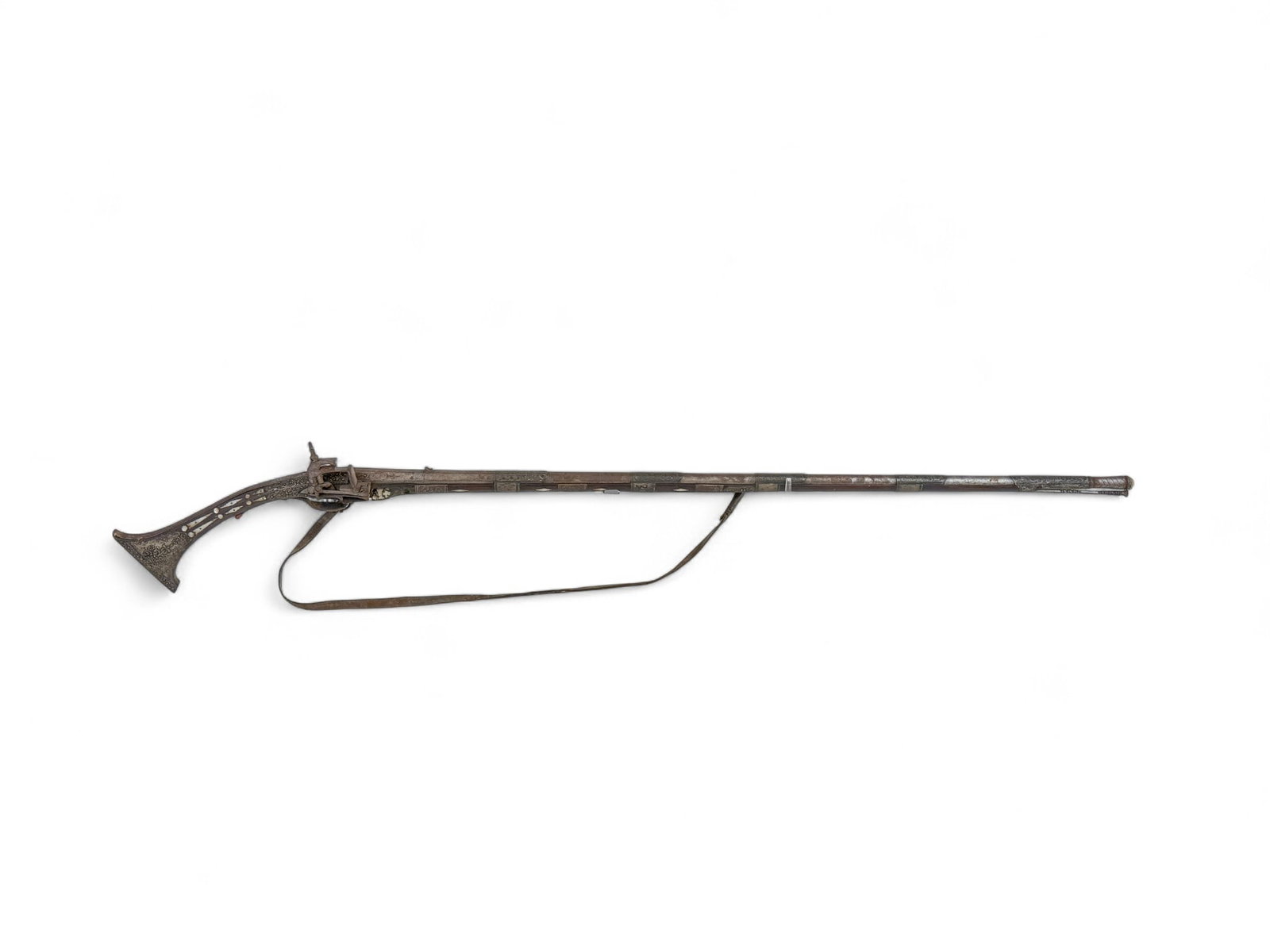 Balkan Tancica Miquelet musket.: [Antique Firearm] An Ottoman Balkan Tancica Miquelet lock musket, Circa 19th Century. 46 1/2" barrel with rear V sight and front bead sight . Full length wood stock with chased repousse silver mounts 