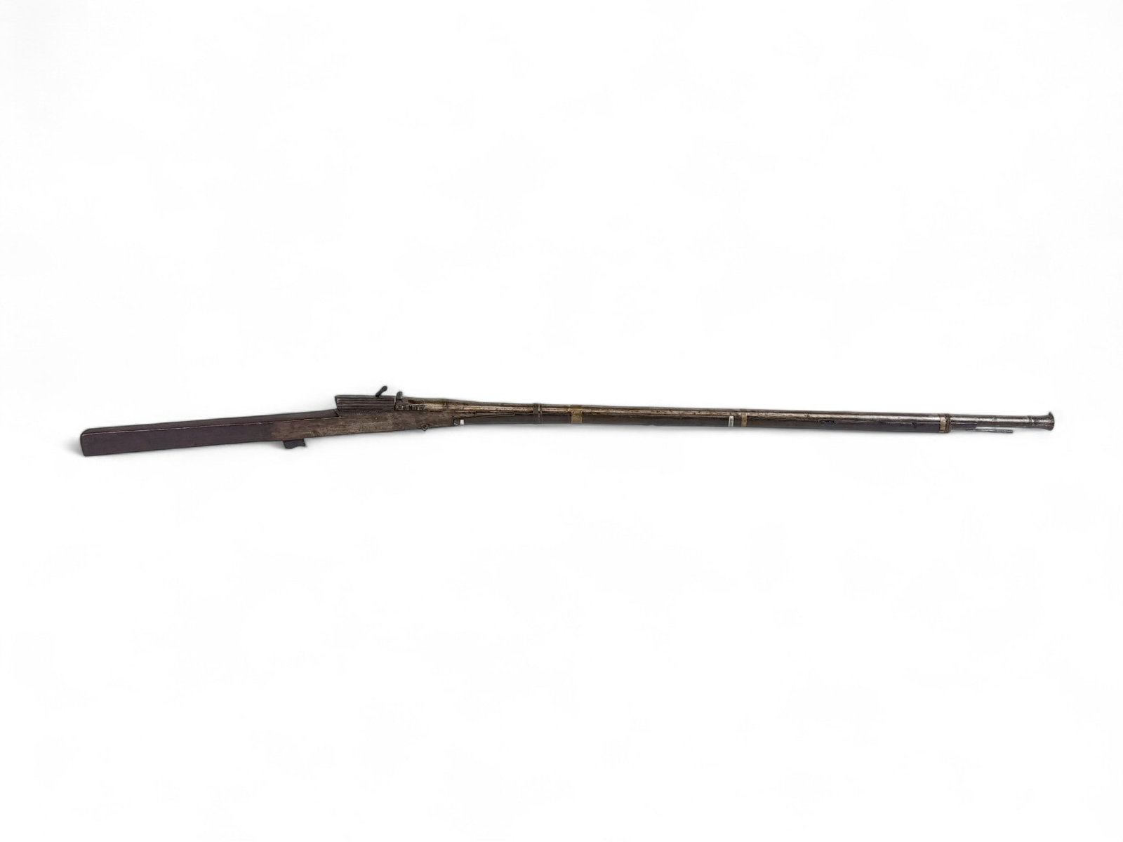 Indian Torador matchlock musket, .60 Cal.: {Antique Firearm] An Indian Torador matchlock musket, .60 Caliber. 18/19th Century. 46" barrel with rear notch and front bead sights. Full length wood stock with metal side plates on action. Includes 