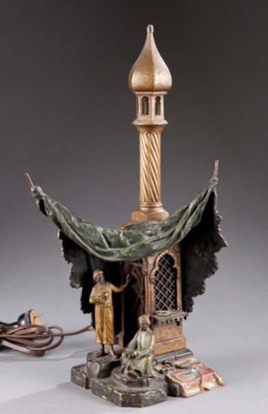 Bergman Austrian painted bronze lamp men, tent.: Bergman, Franz (Austrian, 1838-1894). A cold painted Orientalist bronze table lamp modeled as two men beneath a tent. With Bergman monogram on base. 13 3/4"h. Condition: Small areas of wear and loss