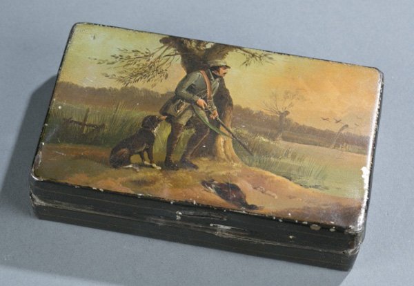 Tobacco tin w/ hunting scene, late 18th/early 19th: A painted metal tobacco tin of hunter with dog and fowl. Late 18th/early 19th century. Unsigned. 1"h x 5"w x 3 1/4"d.