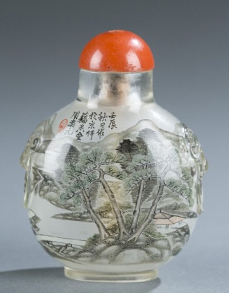Chinese inside painted snuff bottle Zhou Leyuan: A Chinese inside painted glass snuff bottle of landscape setting with two figures. Late Qing Dynasty. Inscribed and signed, "Zhou Leyuan". With mask and ring detail at sides. 2 1/4"h.