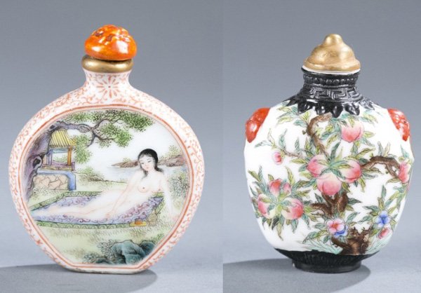 2 Porcelain, enamel snuff bottles 19th to 20th c.: A group of porcelain and enamel snuff bottles. ++ Decorated with peach trees and bats, and molded mask faux handles. Molded mark on the bottom: 2 1/2"h. Front painted as a woman reclining in a bath, r