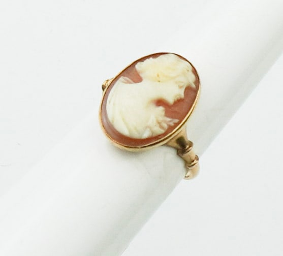 Vintage 10KYG Cameo Ring: Vintage 10KYG Cameo Ring size 6, white on brown cameo of bust of woman, stamped and tested 10K yellow gold, gross weight approx. 1.75dwt