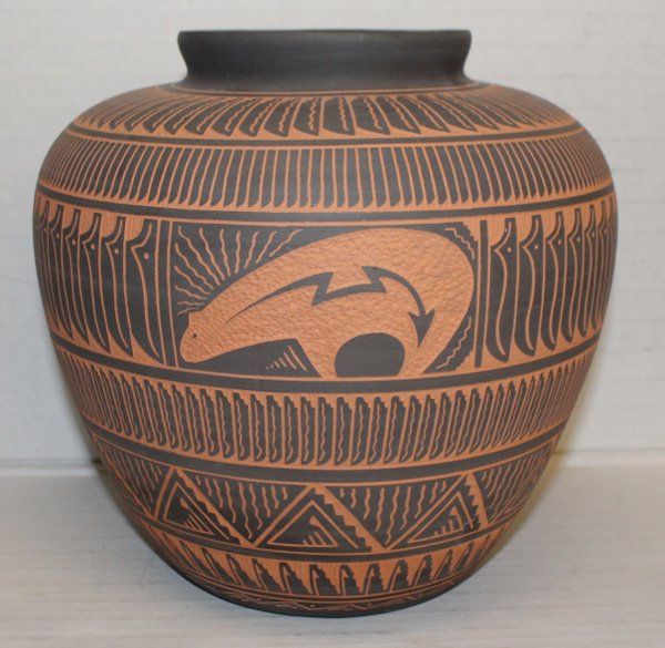 Navajo etched jar signed "TKL Navajo".: Navajo etched jar signed "TKL Navajo 2001". Geometric design with bear at front. 8 3/4"h x 9"d. Condition: Wear to bottom. 1/4" white mark near base.