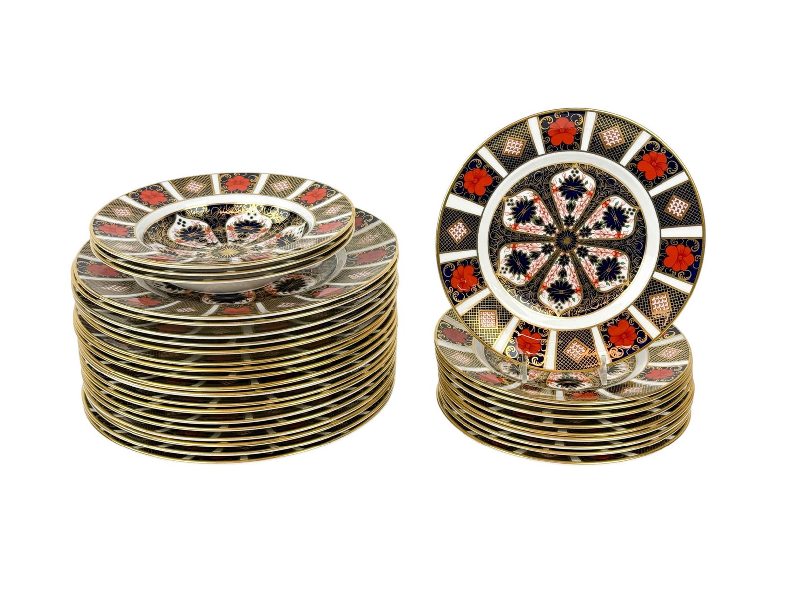 Royal Crown Derby "Old Imari" plates.: A group of thirty-one Royal Crown Derby "Old Imari" plates. English. 20th century/21st century. Red overglaze mark on back. ++ Ten salad plates. 8 1/2". ++ Eighteen dinner plates. 10 1/2". ++ Three so