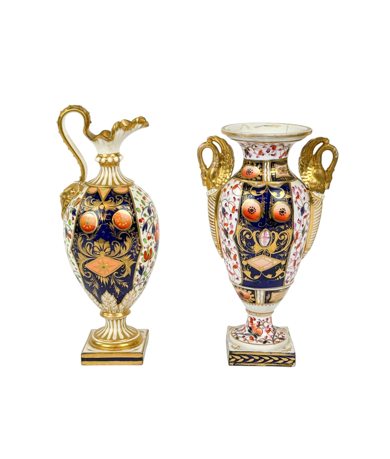 Imari porcelain vase and ewer.: A pair of English porcelain Imari-decorated vases, 19th century.++ Bloor Derby ewer. Decorated in cobalt blue, iron red, and gilt with foliate panels and reserves, with ram?s head handle and gilt inte