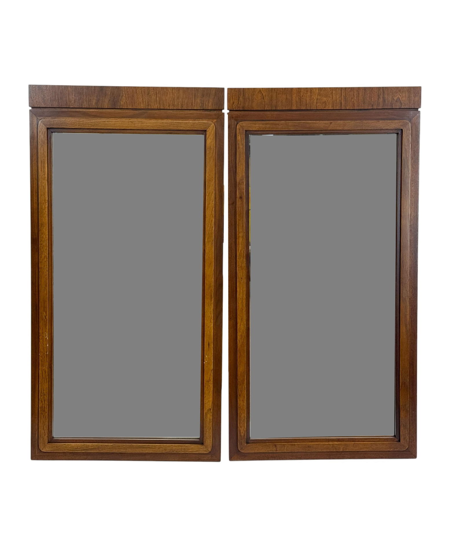2 Founders Milo Baughman walnut mirrors.: A group of two Milo Baughman for Founders walnut mirrors. 45" x 23".
