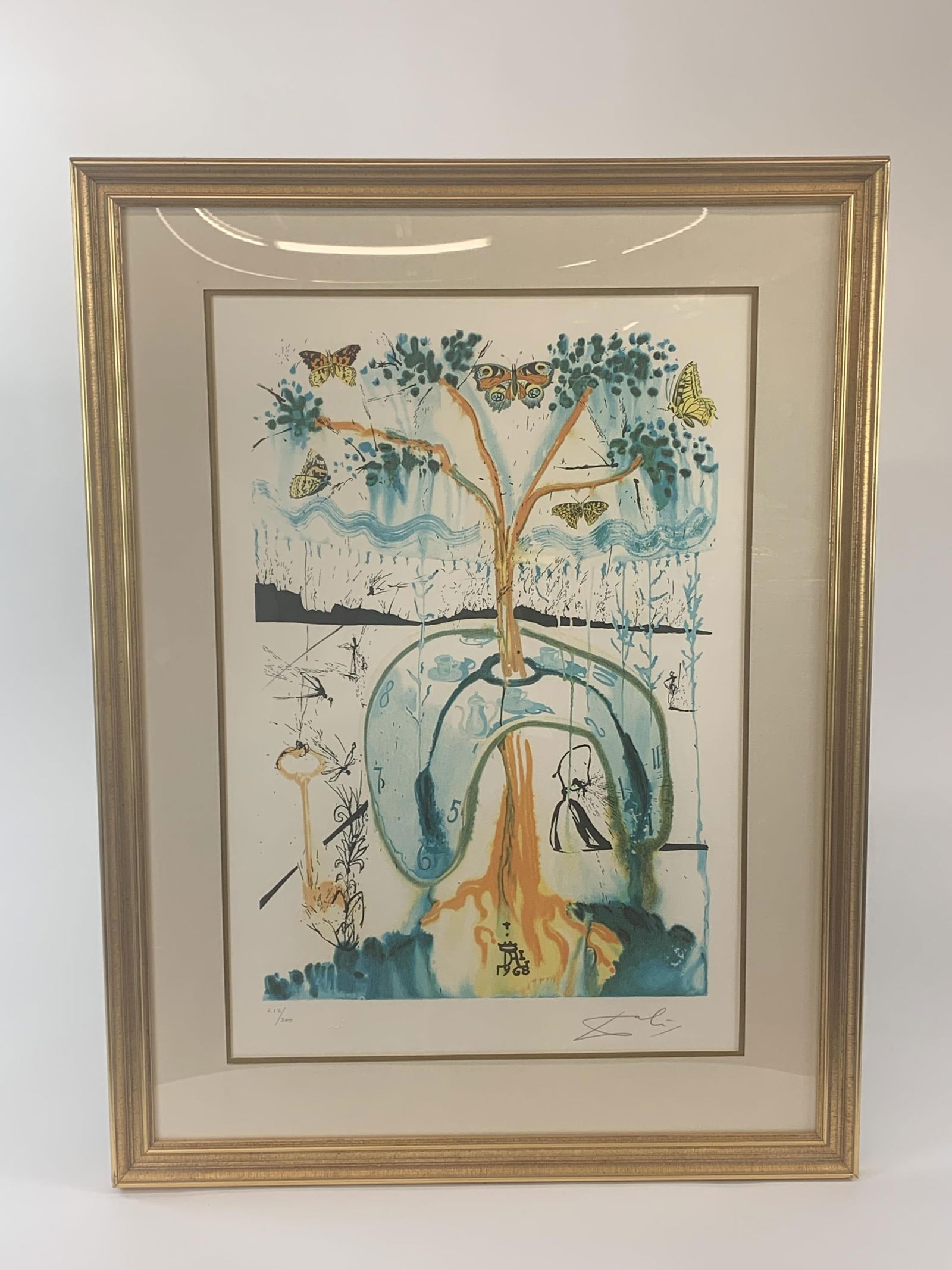 Dali, "A Mad Tea Party," lithograph.: Dali, Salvador (Spanish, 1904-1989)." A Mad Tea Party." Lithograph. 1981-1982. Edition 212/300. Pencil signed and editioned. Embossed logo l.l. Sight: 26" x 18". Frame: 35" x 26".