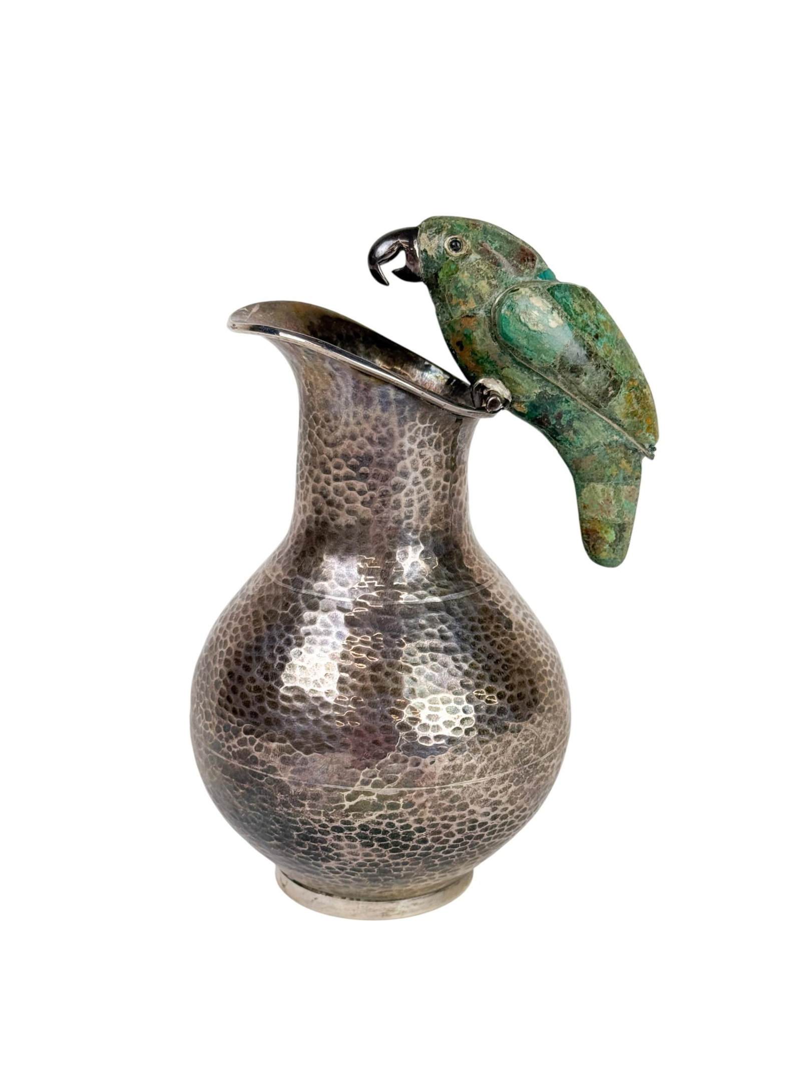 Mexican sterling pitcher with inlaid stone parrot. (1 of 5)