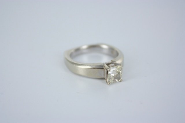 1.02 radiant solitaire diamond and 18kt gold ring: A 18kt white gold radiant cut 1.02 diamond solitaire ring designed by A Jaffee. EGL certificate with SI1 clarity and K-L color grade. Certificate #. tw. 0.3 toz.