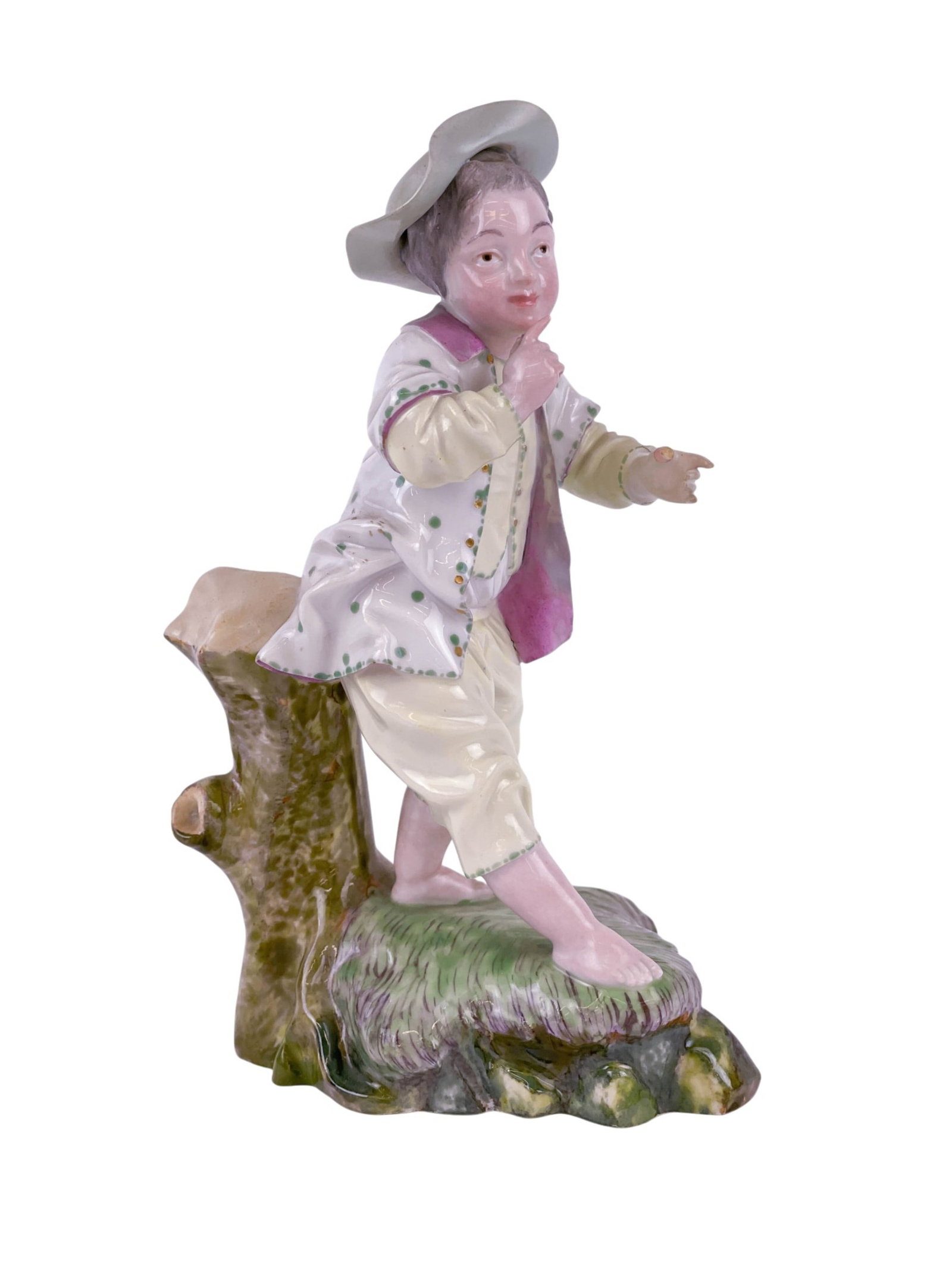 Continental porcelain figure of a young boy.: A Continental porcelain figure of a young boy in a hat standing beside a tree stump. 6 1/4" x 3 1/2" Provenance: From the Estates of Raymond Bahor & Michael Mahoney. Mahoney was a professor and Chair 