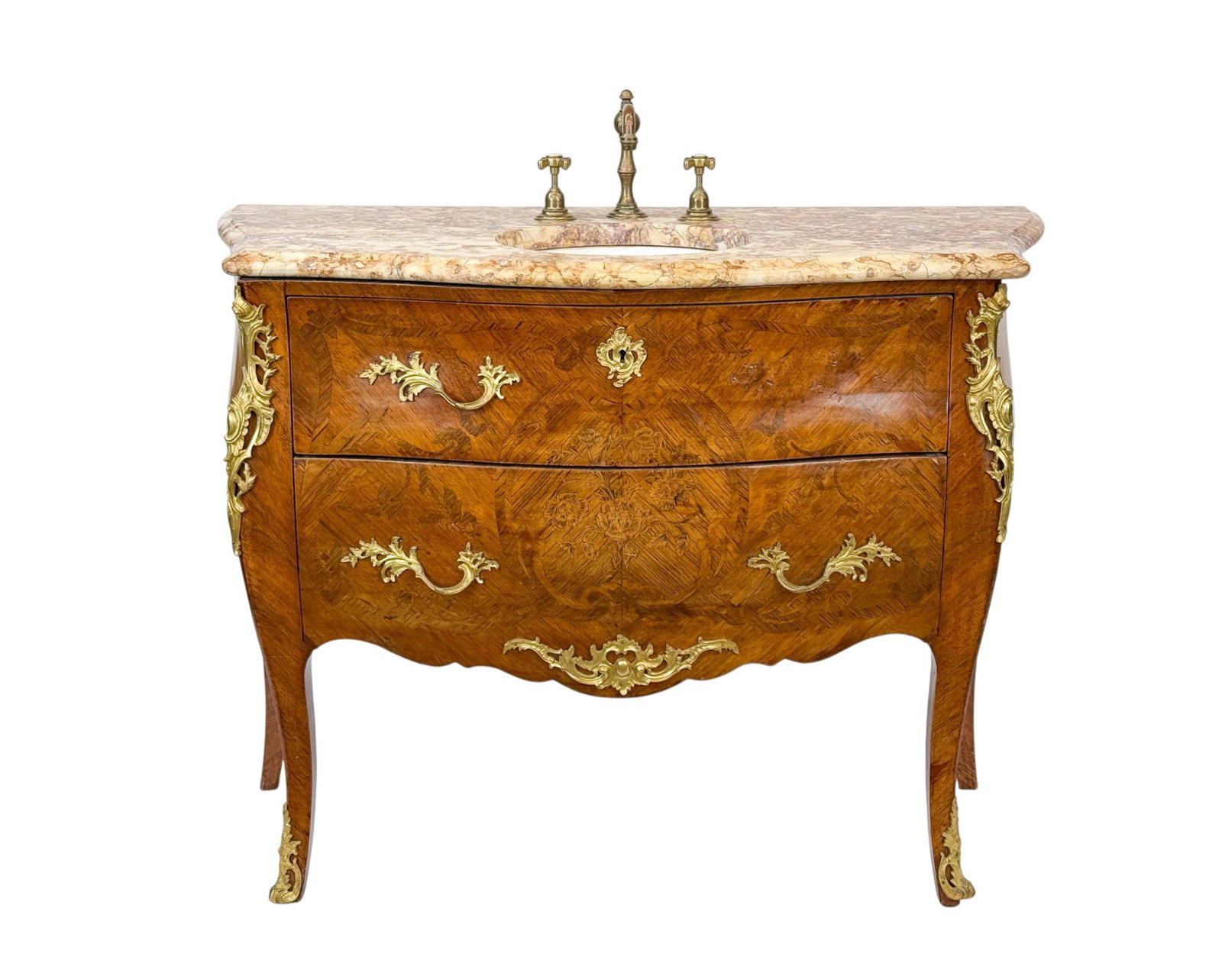 French Louis XV commode converted to a sink.: A French Louis XV commode ormolu mounted converted to a sink with pink marble, 18th/ 19th Century. Lille Herbeau brass faucet and porcelain wash basin. 44" x 47 1/2" x 20 1/2". Condition: Missing pull