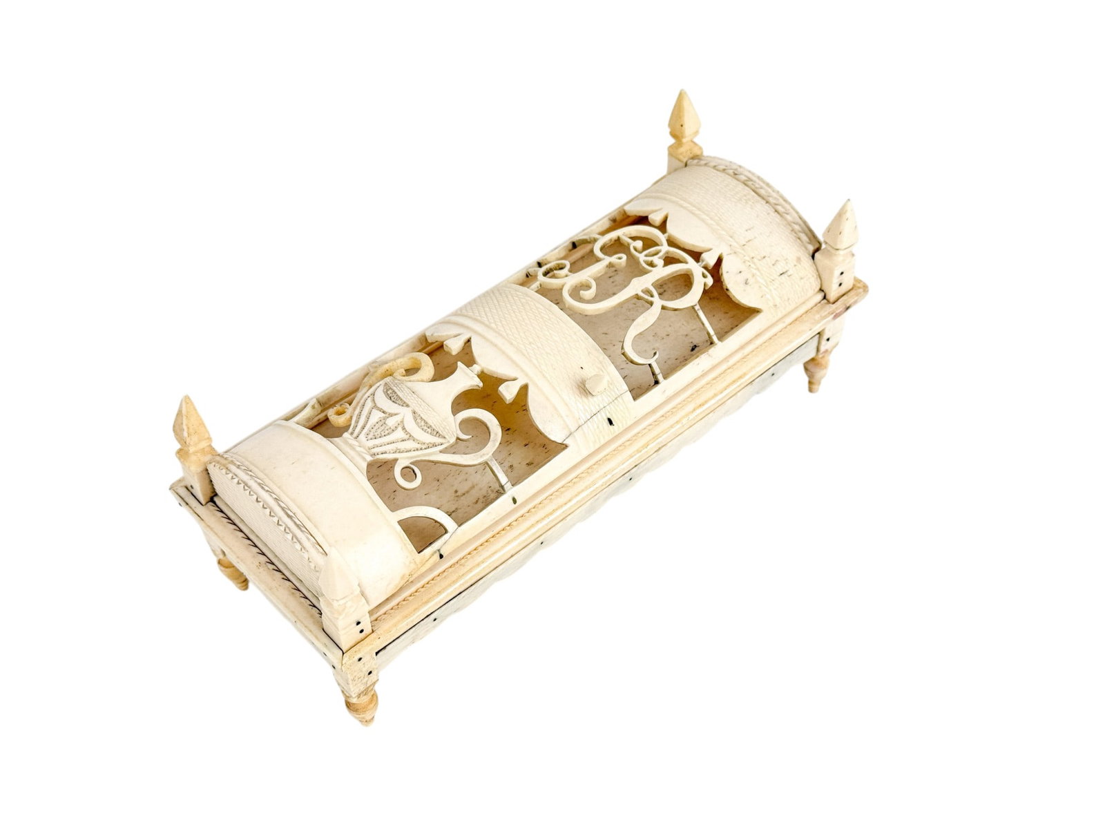 Russian carved bone game box, Late 18th c.: A carved bone game box with dominoes and cribbage pieces inside. Late 18th century. Russia. 3" x 7". Condition: Various cracks, broken hinge on door. Provenance: Purchased from Hoffman Gampetro