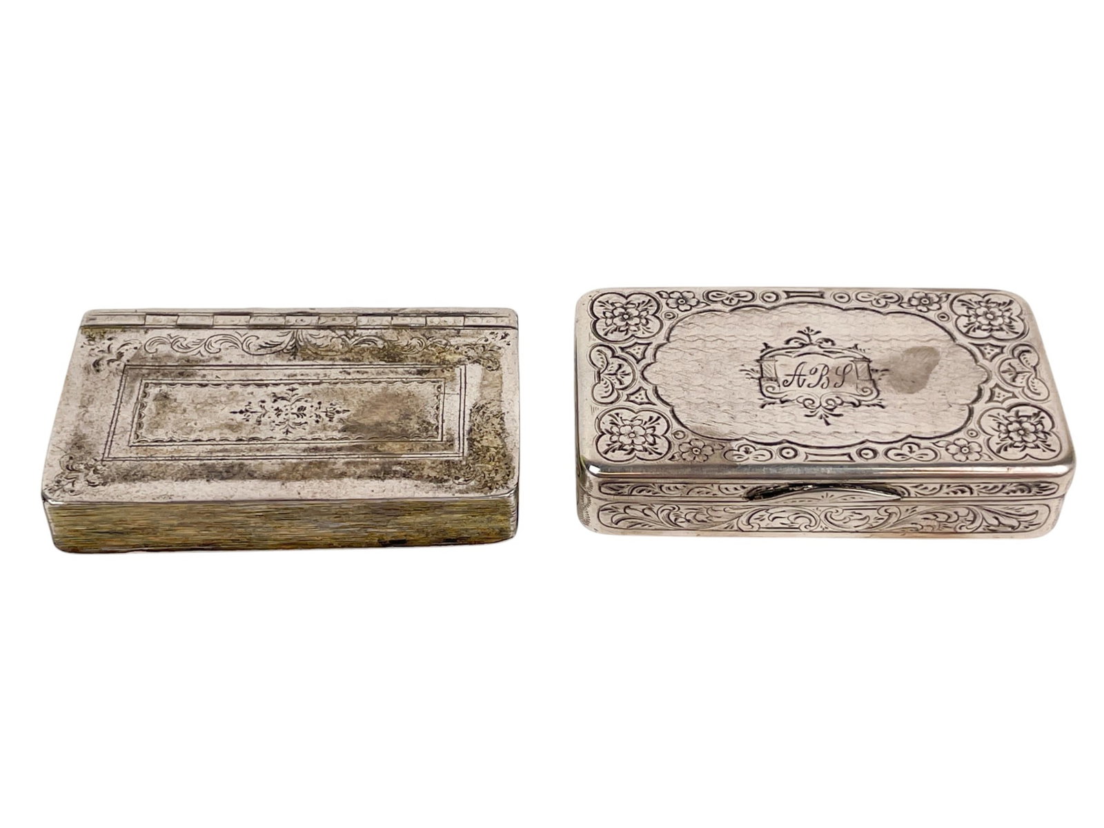 2 Silver boxes.: A group of two silver boxes. ++ Russian box. "NF" maker's mark, 1859 Assay mark, 84 Zolotnik, and Moscow. 2.82 ozt. 3 1/8" x 1 3/4" x 6/8". ++ Unmarked book form box with gold washed interior. 2.13