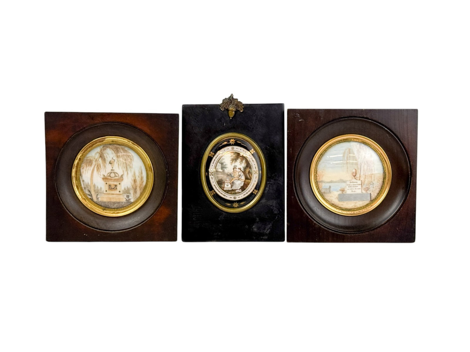 3 Needlework memorials.: A group of three needlework and painting memorials. Includes one with a memorial in German and one with male and female figures watering flowers on a headstone. Smallest: 5 1/8" x 7/8". Largest: 5