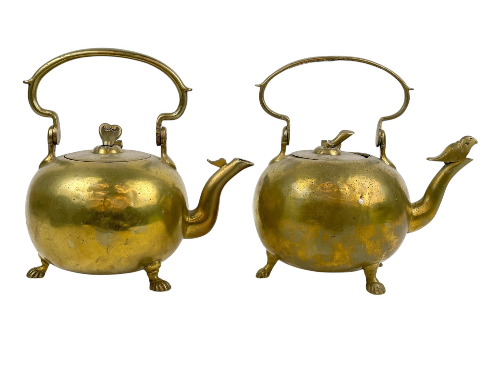 2 English brass footed teapots.: A group of two English brass footed teapots. Smallest: 10" x 10" x 6 1/2". Largest: 10 1/4" x 9 1/2" x 6 1/2".