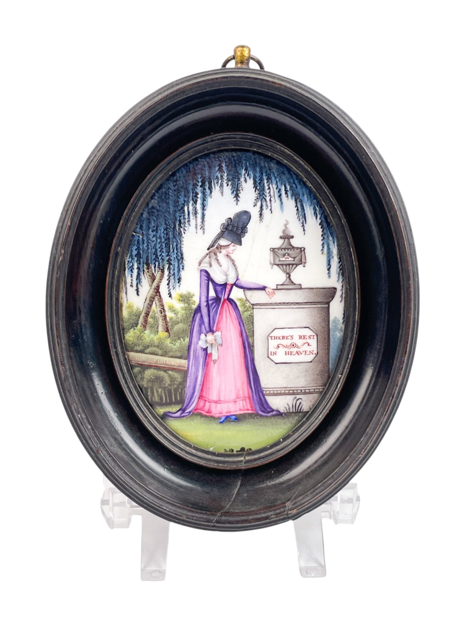 Painted porcelain plaque.: A painted porcelain plaque of a lady in mourning at a tomb with plaque that reads "There's Rest but in Heaven". 19th century. Sight: 3 1/2" x 2 1/2". Frame: 5" x 4". Condition: Cracks in plaque.