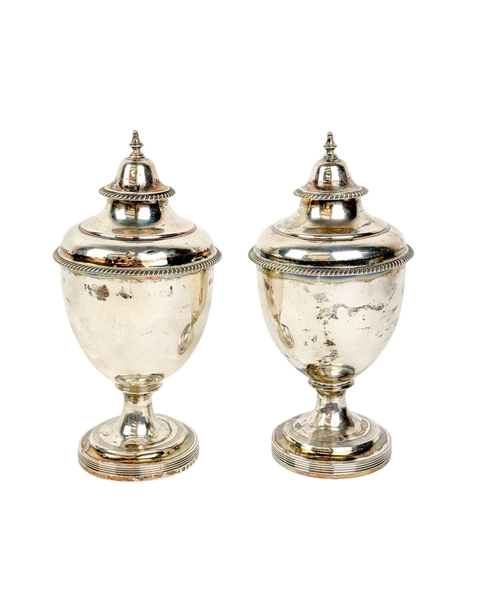 2 England Regency sterling urns.: A group of two England Regency sterling urns. Obliterated maker mark with 1806 London mark and Thomas Wallis and Jonathan Hayne (TW over JH) with 1813 London mark. 19.34 ozt. 8" x 4".
