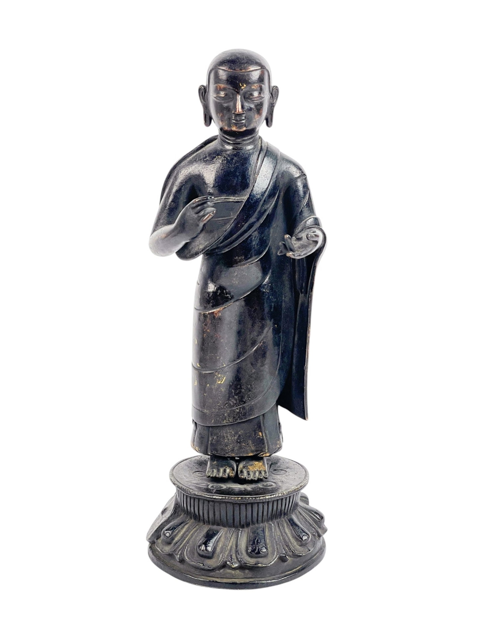 Chinese bronze standing Buddha.: A Chinese bronze standing Buddha on lotus throne. 10" x 3 3/4". Condition: Remnants of gilt.