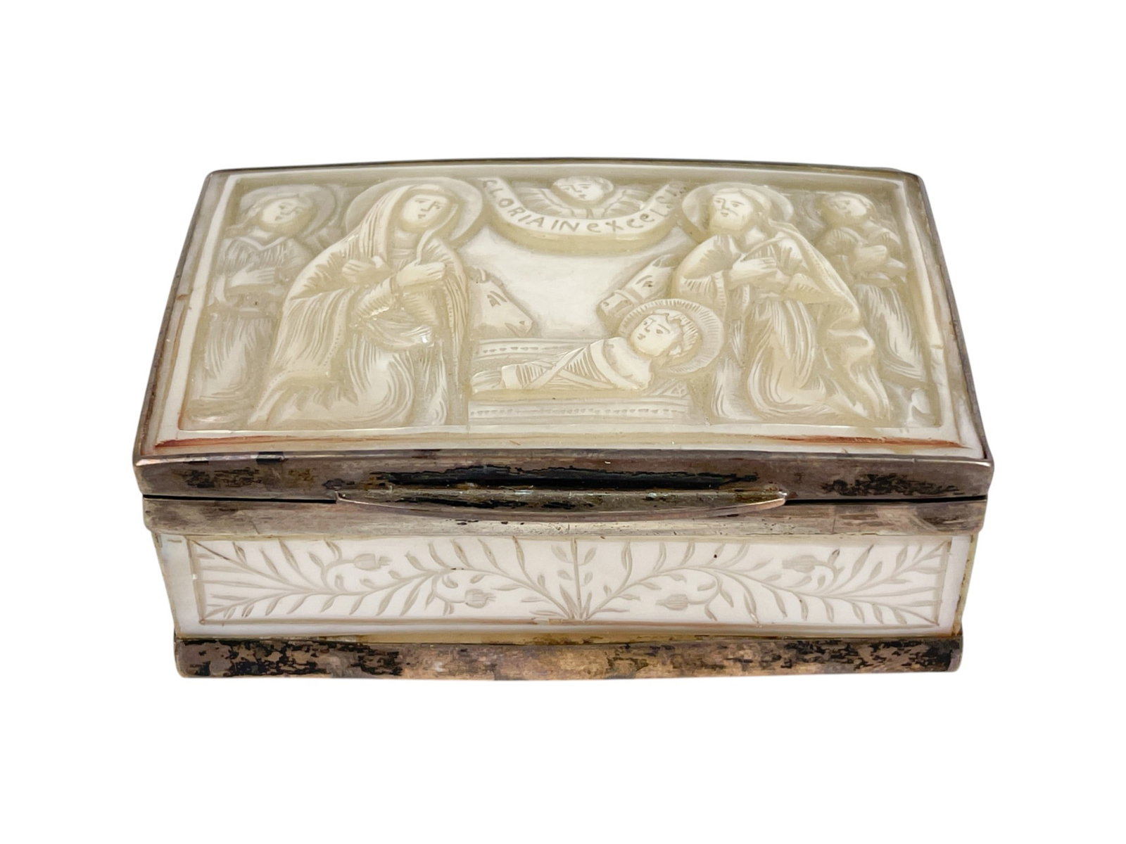 Continental Mother of Pearl silver box.: A Continental Mother of Pearl and silver box decorated with a nativity scene on lid and Saint John the Evangelist on bottom. Unmarked. Late 19th century. 1" x 2 1/2" x 1 3/4". Provenance: Includes