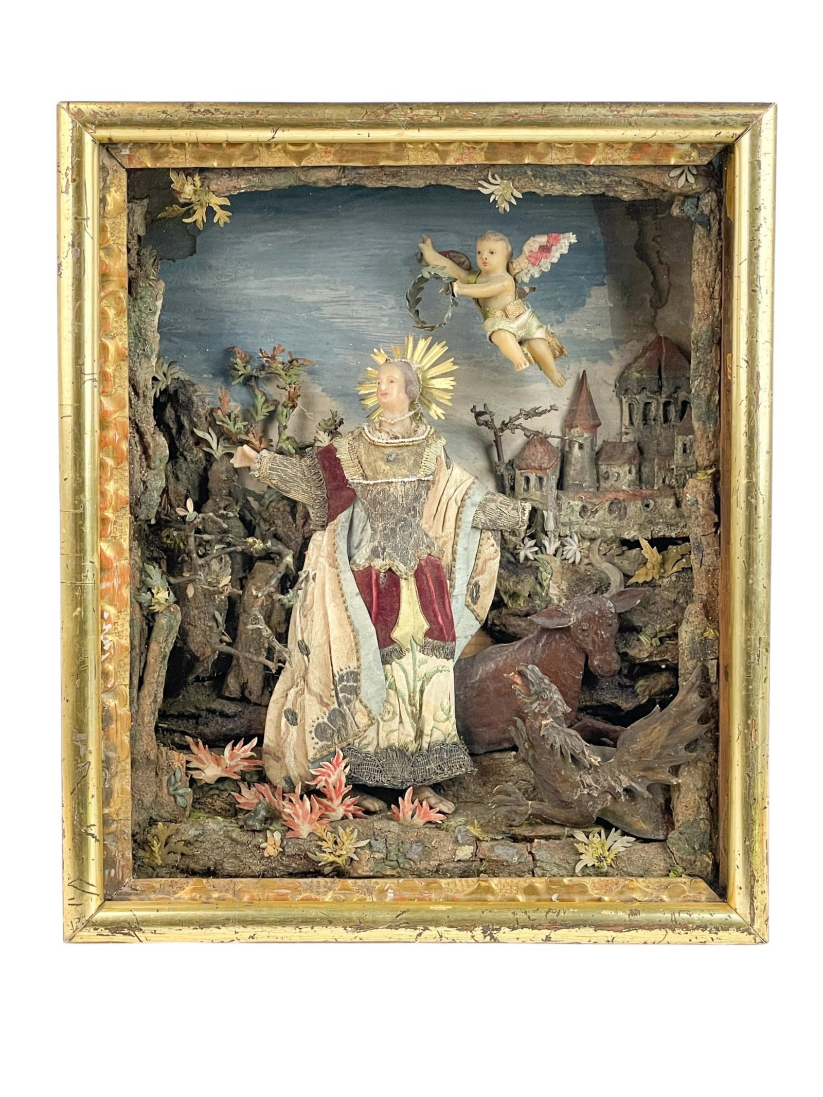 Victorian Coronation of the Virgin, wax diorama.: A Victorian Coronation of the Virgin mixed media wax diorama with cherub wearing a crown over Mary in a silk dress with silver lace. Dragon and cow in foreground and castle in background. 19th