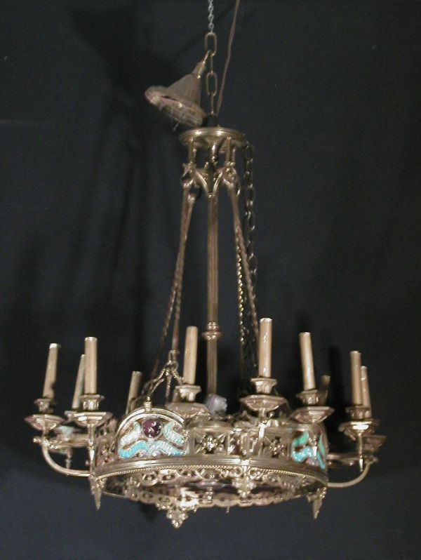 Art Deco style bronze 12 light chandelie: Art Deco style bronze 12 light chandelier with side color glass panels, long center column, amber colored glass bottom, 1920s-30s, 30"h x 28" diameter.