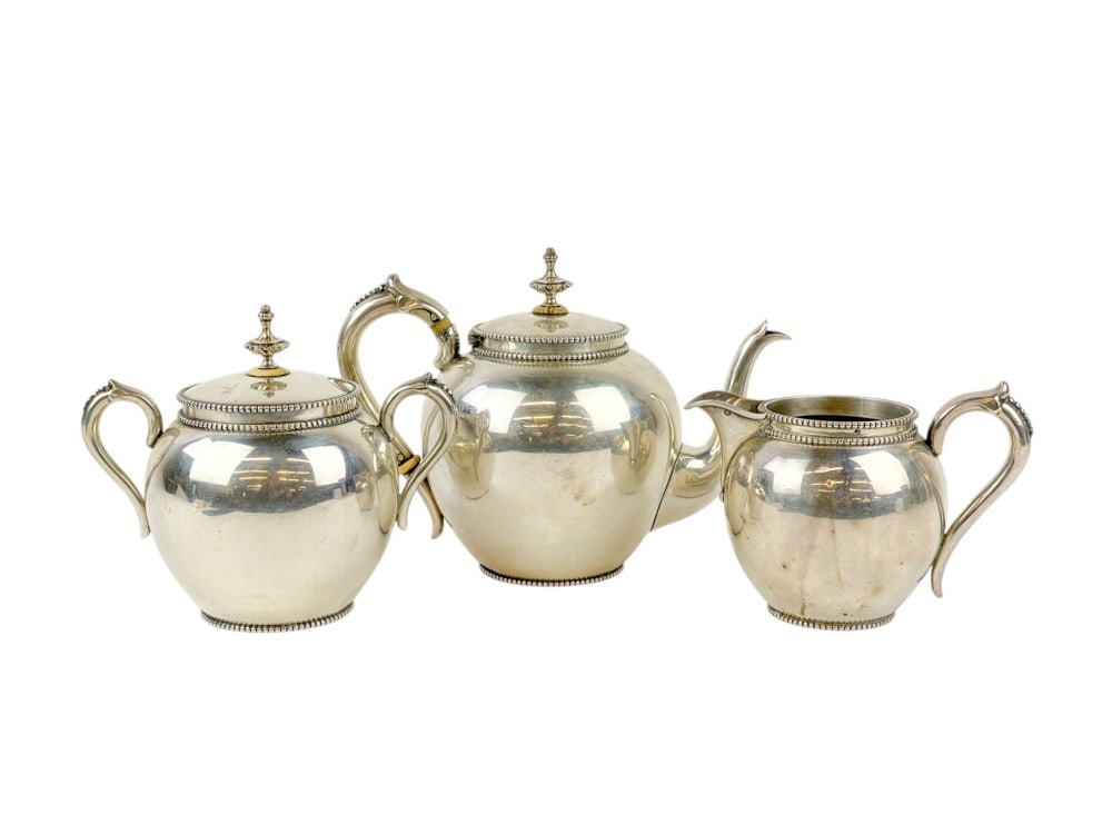 Dutch Kempen silver tea service.: A Dutch JM Van Kempen and Sons, Voorschoten (1858-1924) silver three piece tea set. "VK" maker's mark and .934 lion hallmark. ++ Teapot. 14.68 ozt. 53/4" x 8" x 4 1/2". ++ Lidded sugar. 11.05 ozt. 5"